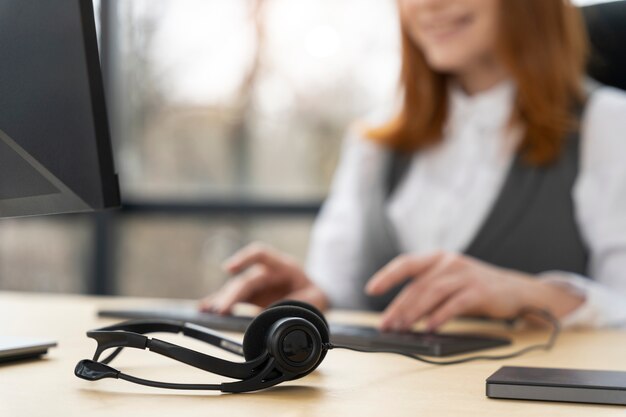 Close up on person working in call center Free Photo